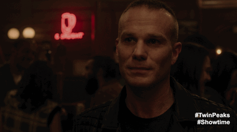 James in Roadhouse with neon sign animated GIF