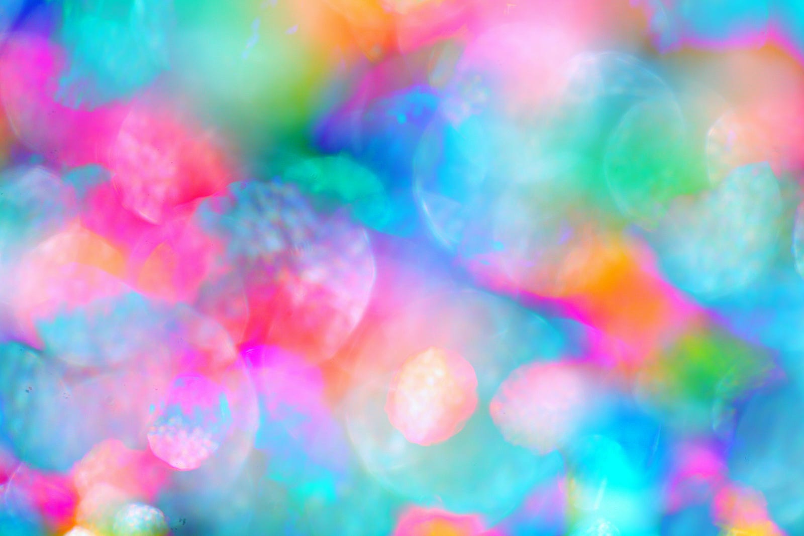 A field of pastel red, blue, yellow, an orange colors.