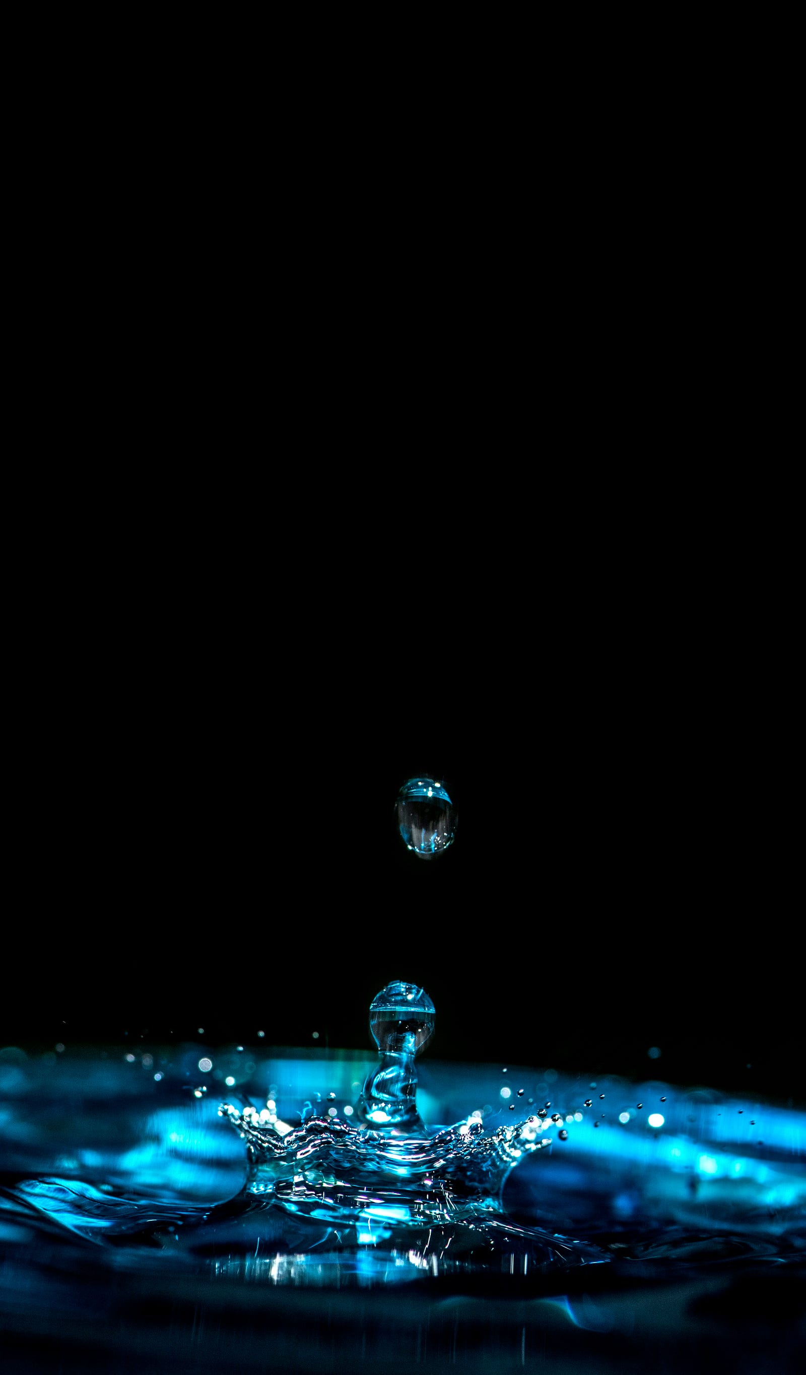 Water drops descend from above, landing in a puddle with a splash. Being dehydrated by only two or three percent can drop my gym performance by up to 20 percent. This reduction is because my ability to regenerate ATP, move nutrients, and flush out lactic acid drastically drops when I am not hydrating enough. Adenosine triphosphate (ATP) is the energy source for use and storage at the cellular level.