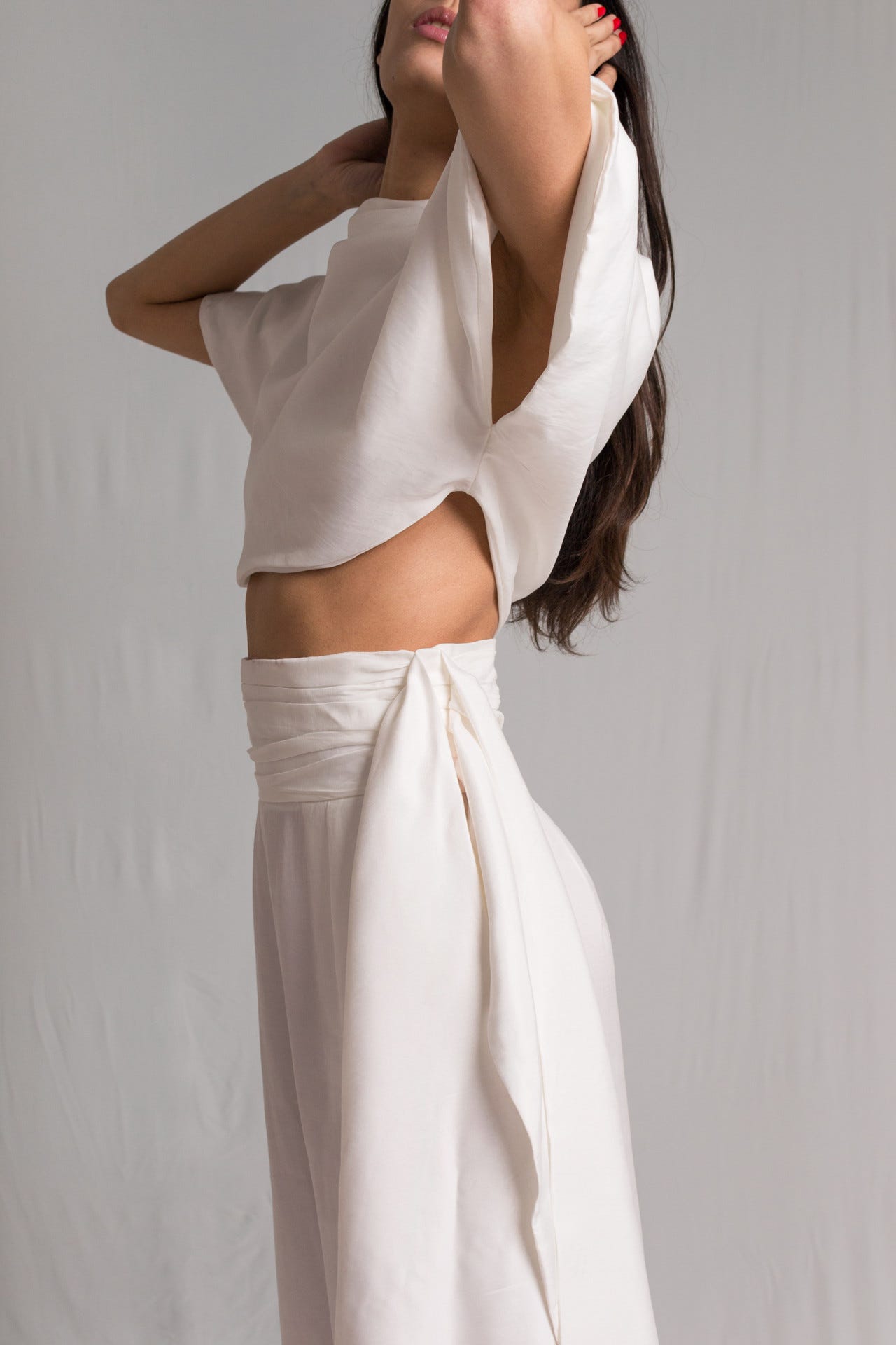 Bastet Noir made to measure white cupro silk two piece set with high waist pants and cropped top with semi short sleeves