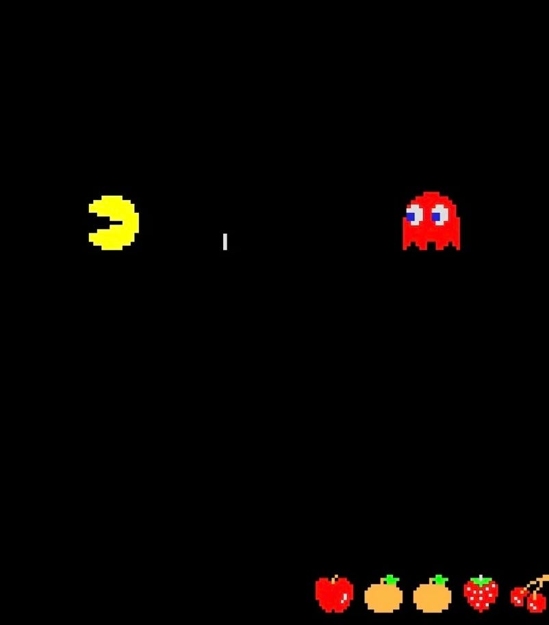 Pac-Man pursued by a red ghost with an unknown obstacle in the way.