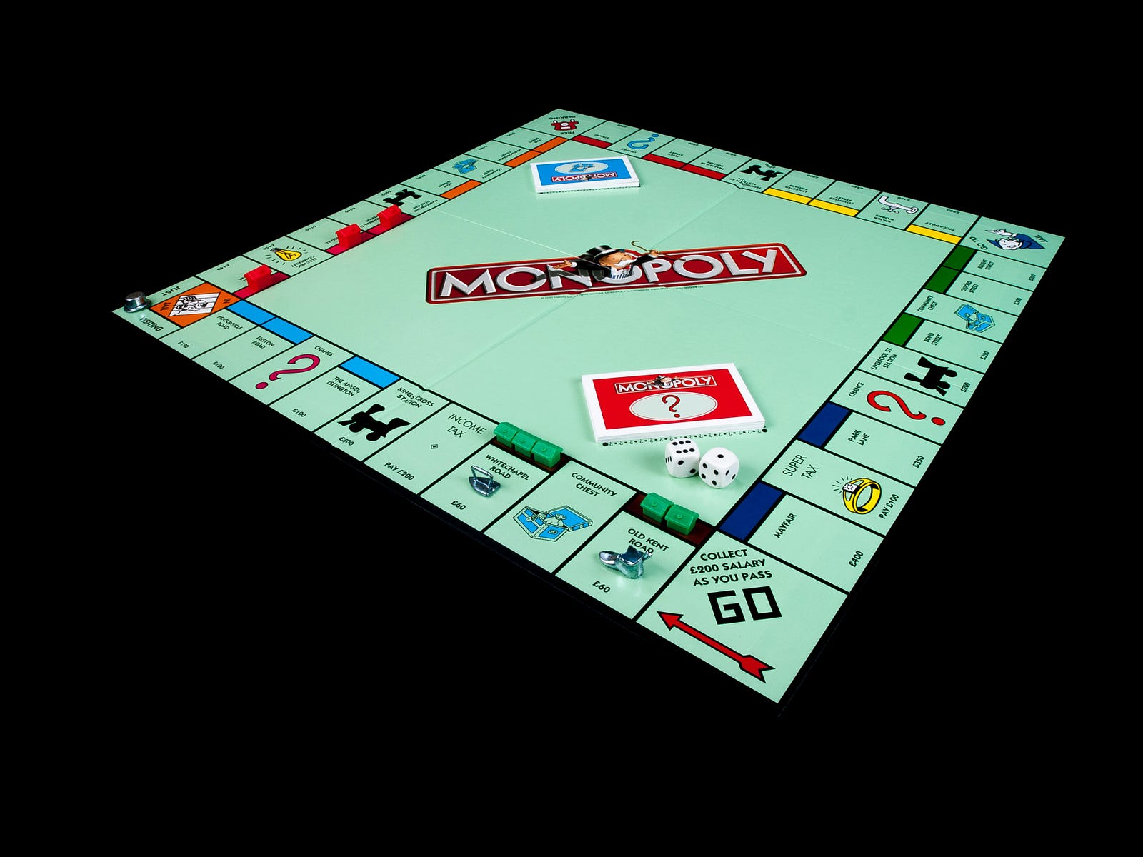 Close-up of a Monopoly board, symbolising competition, inequality, and the pressures of capitalist society.