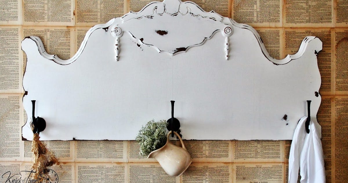 An antique headboard repurposed into a beautiful hanging station.