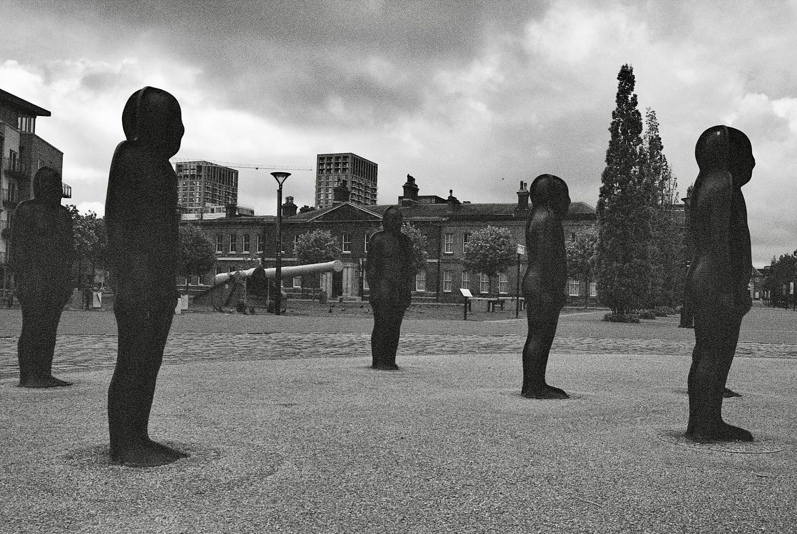 A black and white image of statues at the Royal Arsenal Riverside development in Woolwich, southeast London.