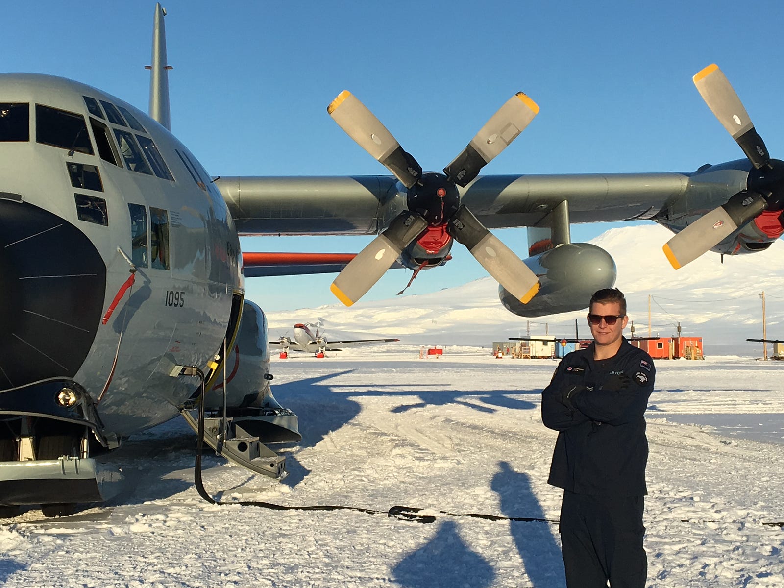 aircraft technician corporal dutchie lynch from the royal new zealand air force with a us lc 130 skibird transport aircraft at williams field in antarctica