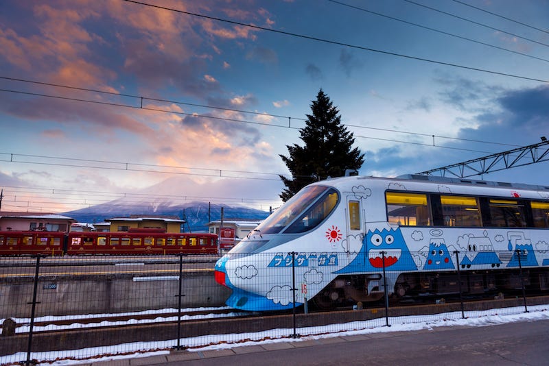 A train bound for Kawaguchiko Station in Yamanashi Prefecture with Mt. Fuji in the background