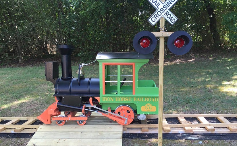 This Grandpa Built a Backyard Railroad for His Granddaughter