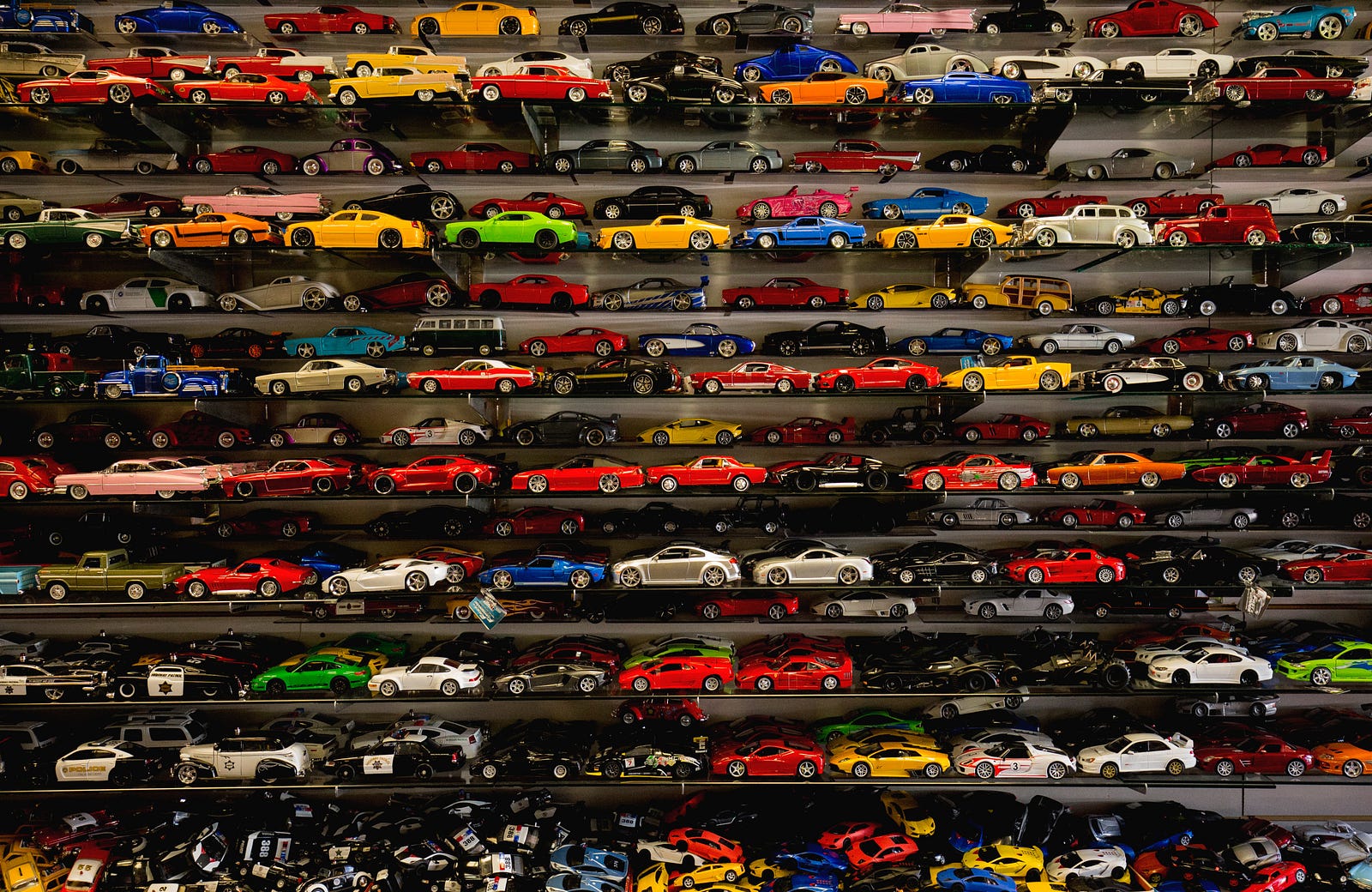 Model cars on shelves.