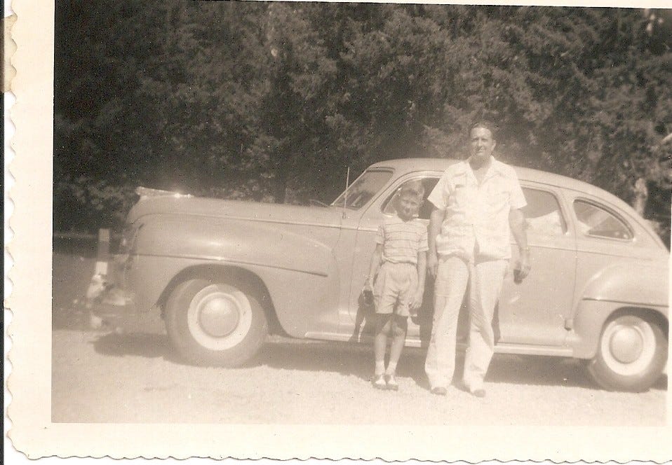 Photo of Vedder and Frank Steed in front of a 1942 DeSoto c1946