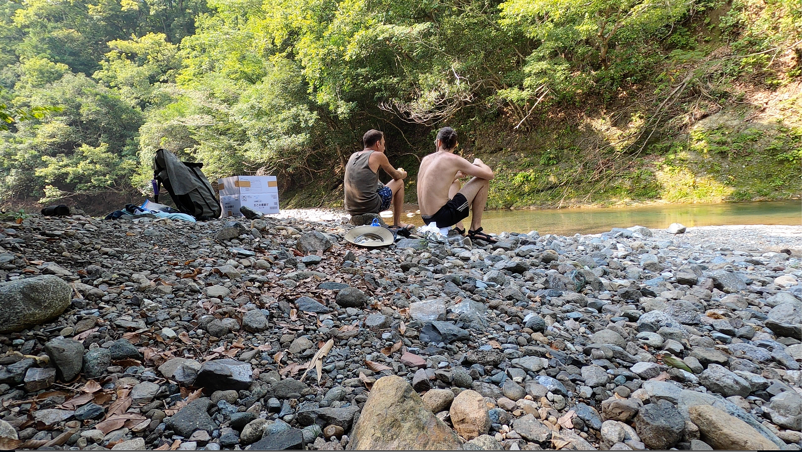 Eating burgers riverside after finishing at the farm.