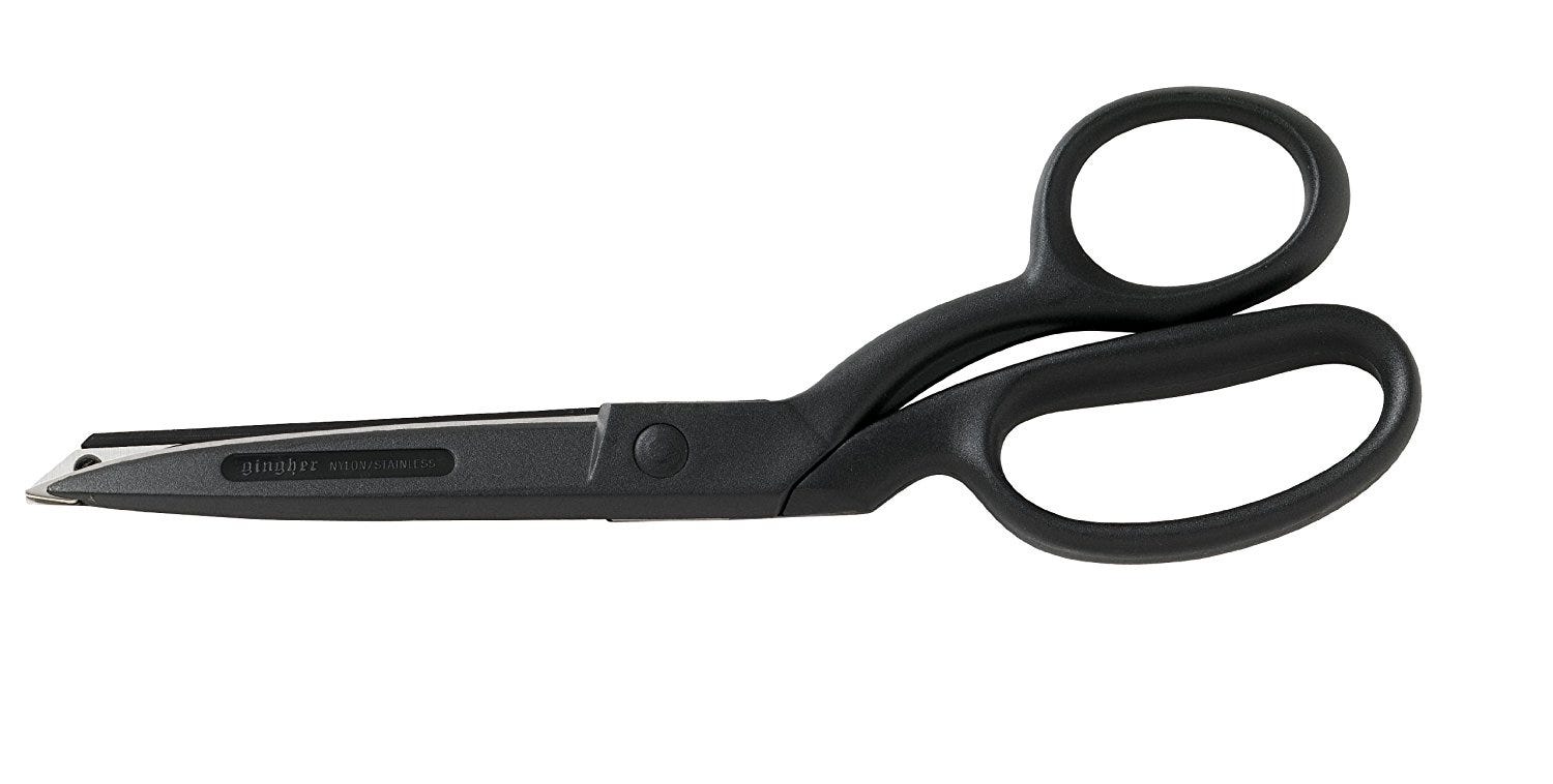 Grey pair of full size scissors pointing left. 