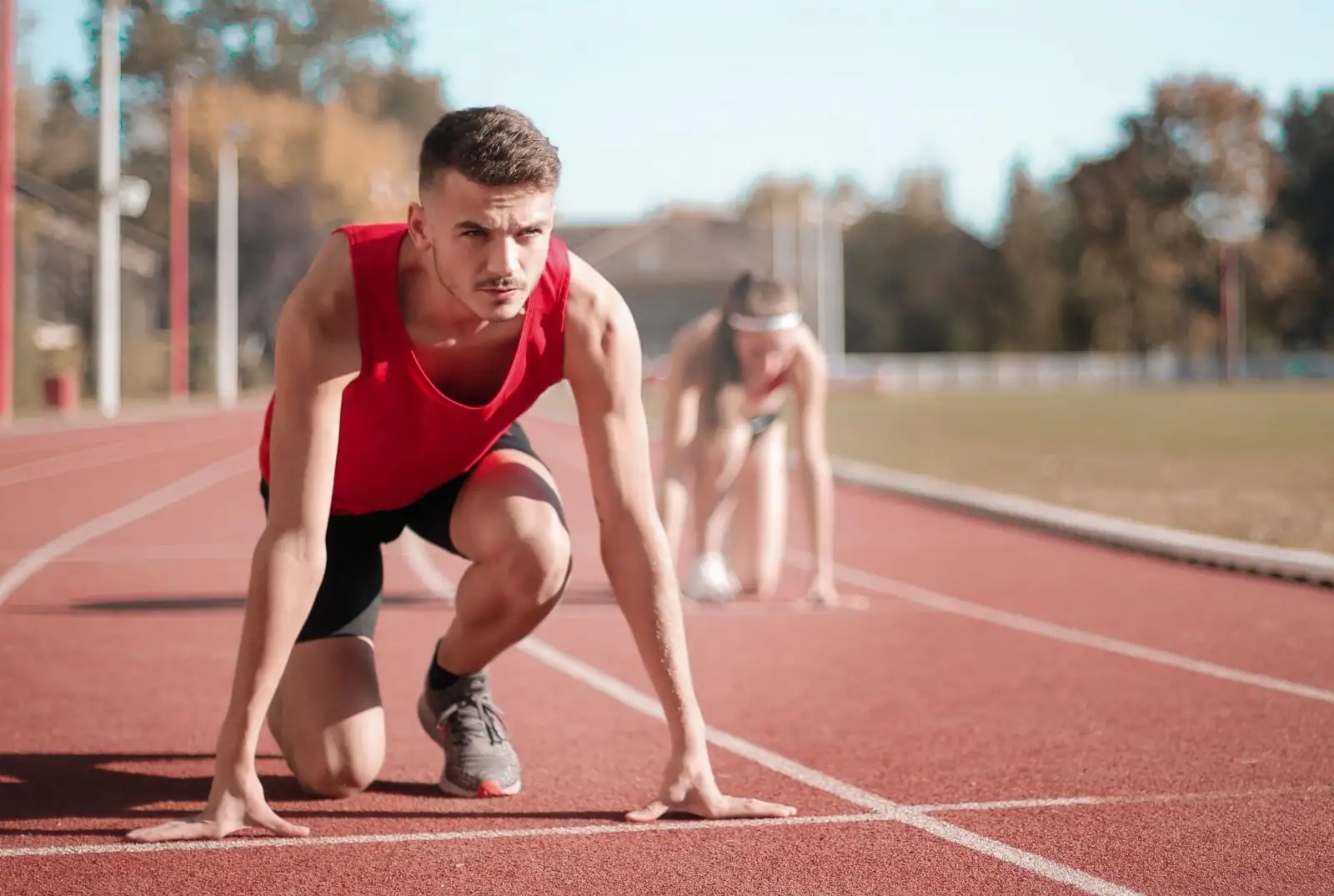 a runner getting ready to start a race on the track