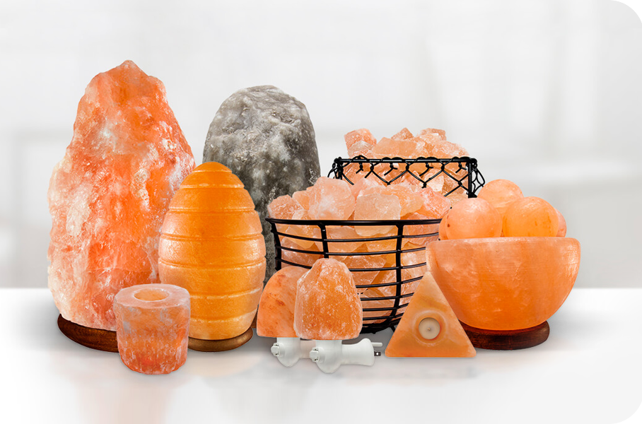 Various decorative and functional items made from Himalayan pink salt, including lamps, candle holders, and salt rocks, showcasing their aesthetic appeal and wellness benefits.