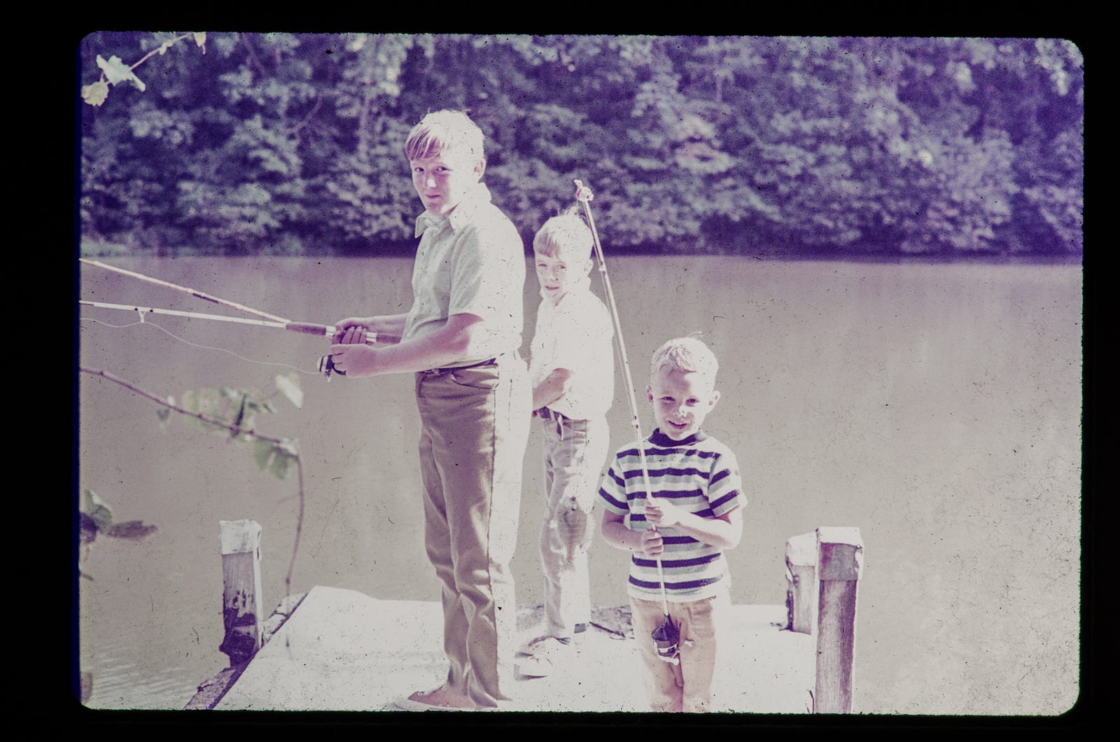 Photo of Ron Steed and his brothers Kevin and David, fishing.