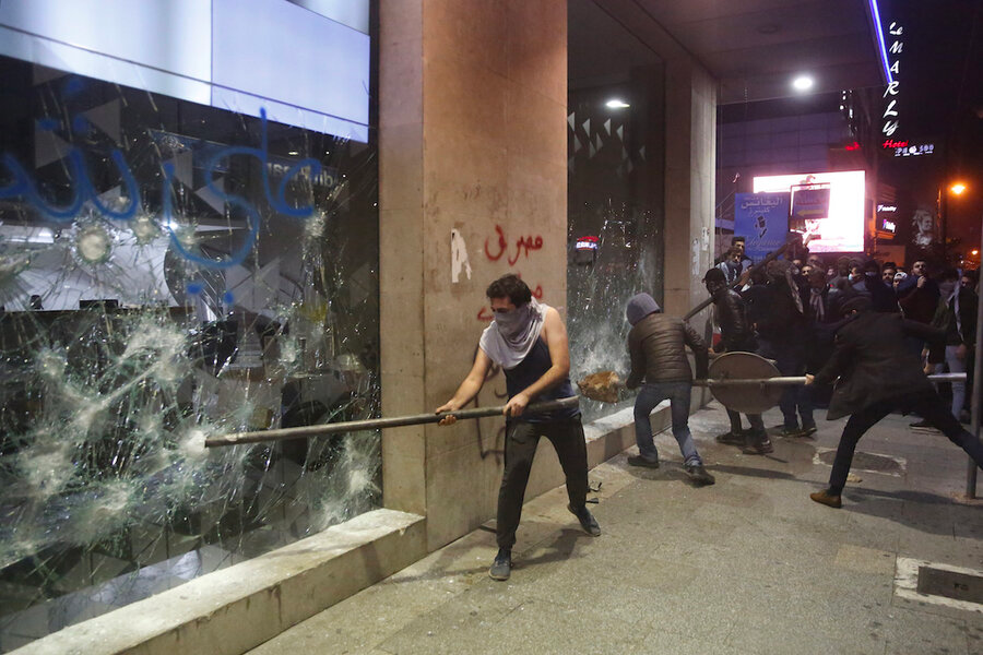 Customers breaking into Lebanese banks that withheld deposits. Source: Hussein Malla/AP