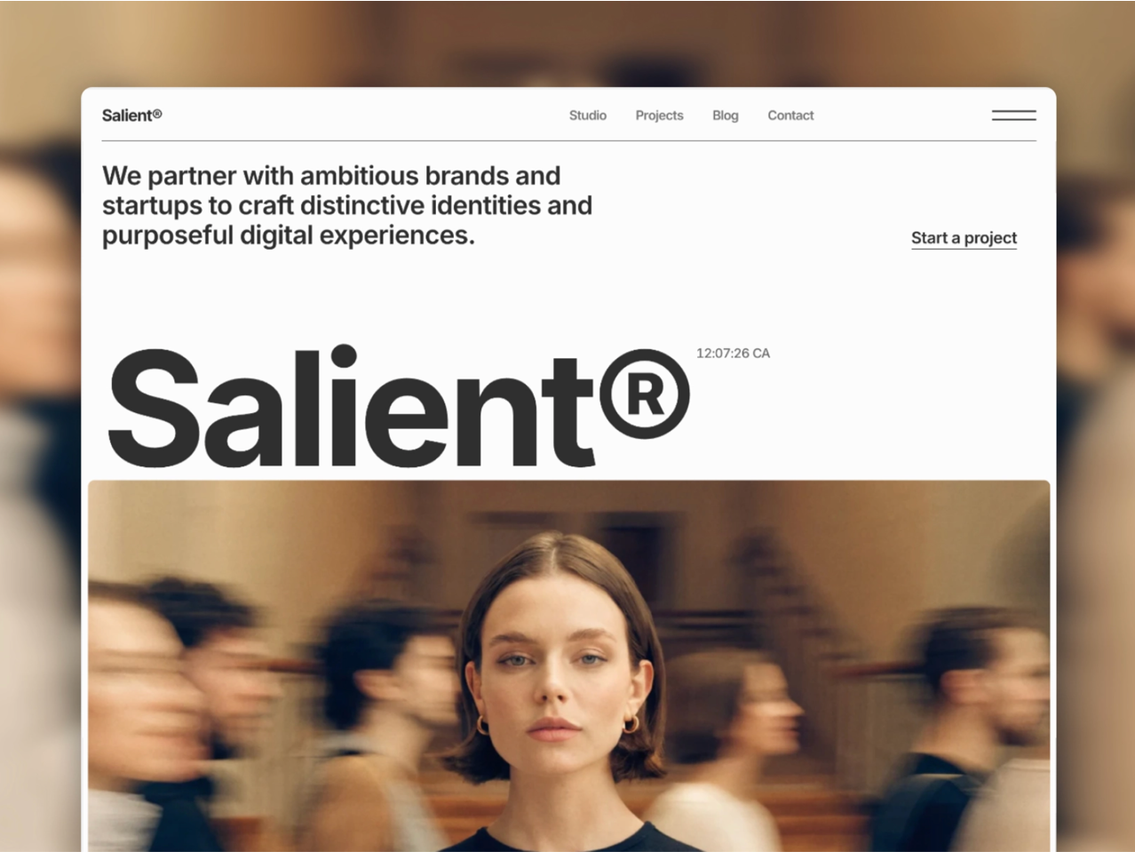 Salient website template featuring bold typography and a minimal layout with a portrait image in the hero section