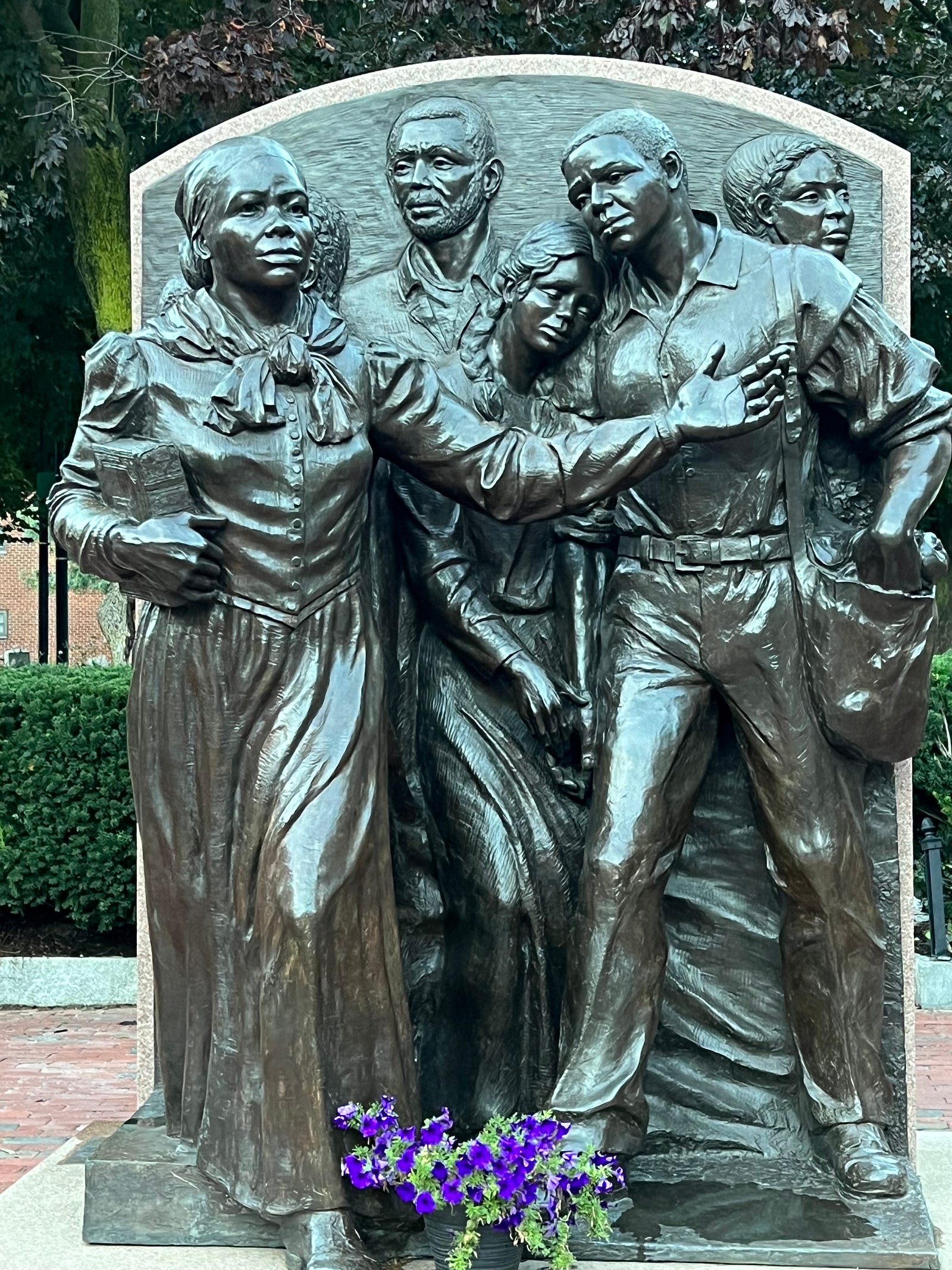 Photo of the Harriet Tubman Memorial in Boston, Mass showing Tubman leading a family of enslaved people to freedom.