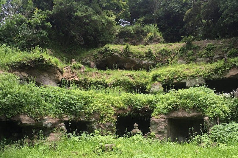 A close up shot of the Mandarado Yagura tombs in Kamakura