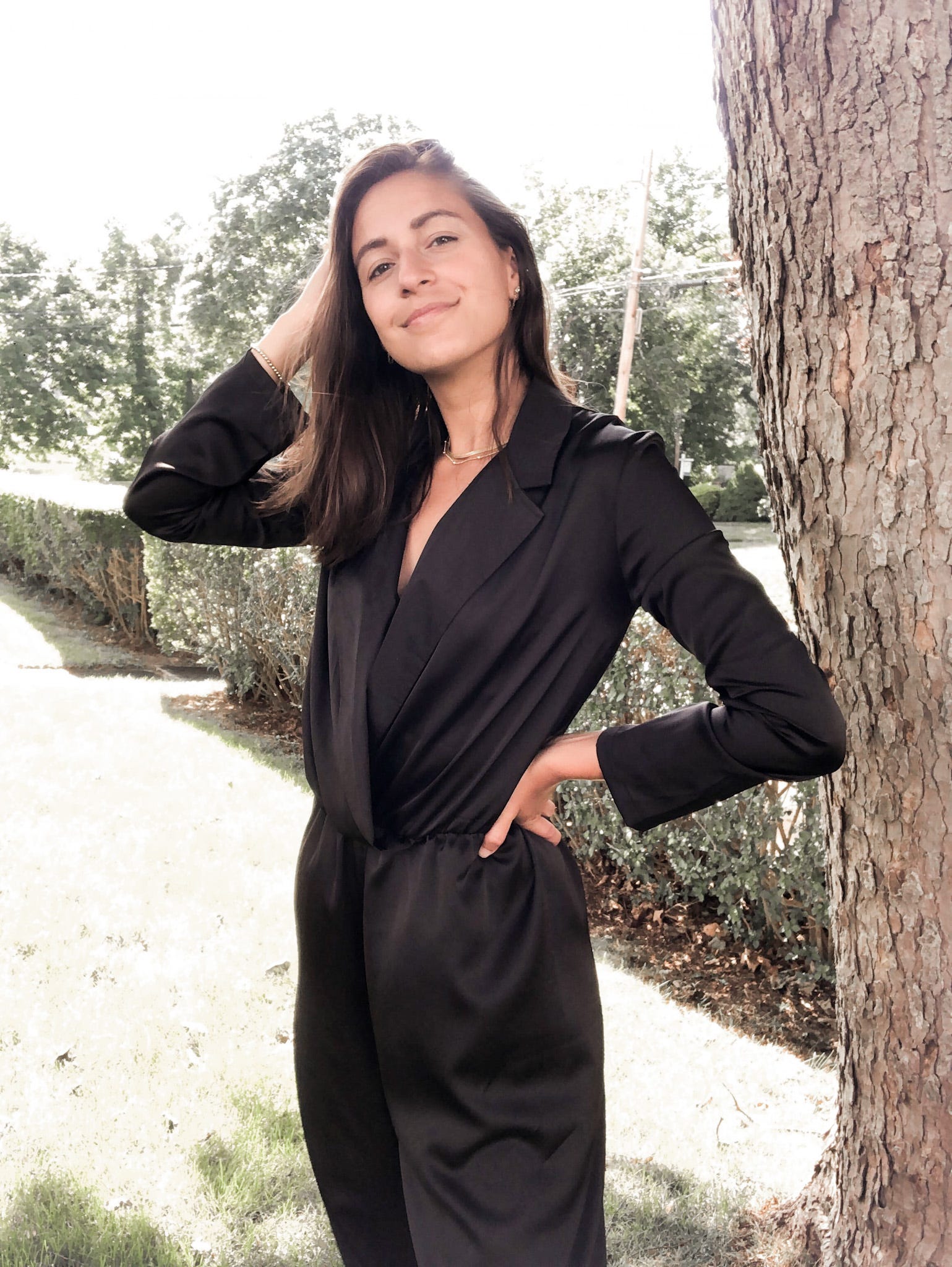 Cait Khosla, the founder of Botany Box wearing The Black Satin Jumpsuit by Bastet Noir custom made for her