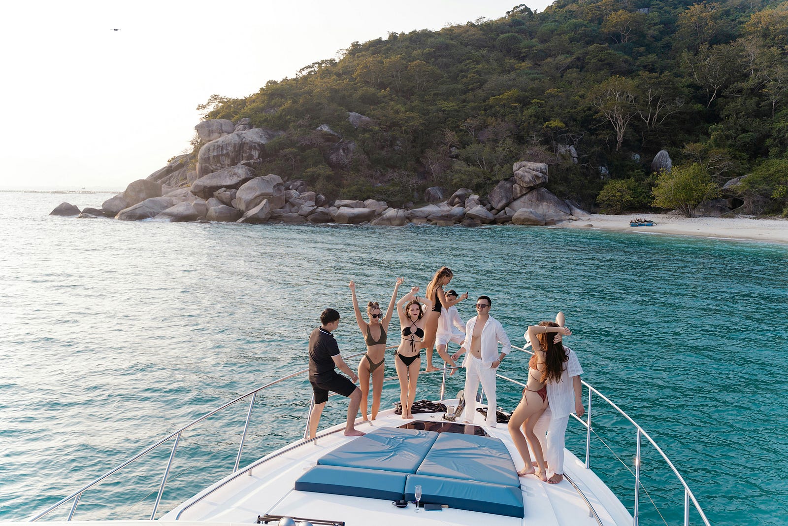 Influencers on a luxury yacht, representing aspirational lifestyles and social media-fueled envy.