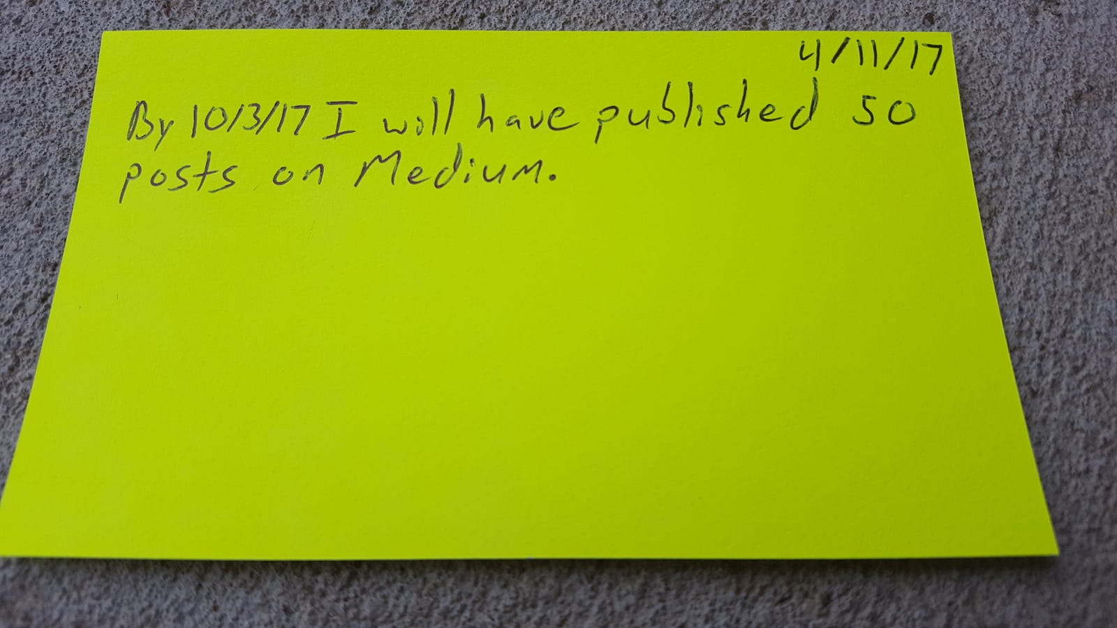 Notecard that reads "By 10/3/17 I will have published 50 posts on Medium."