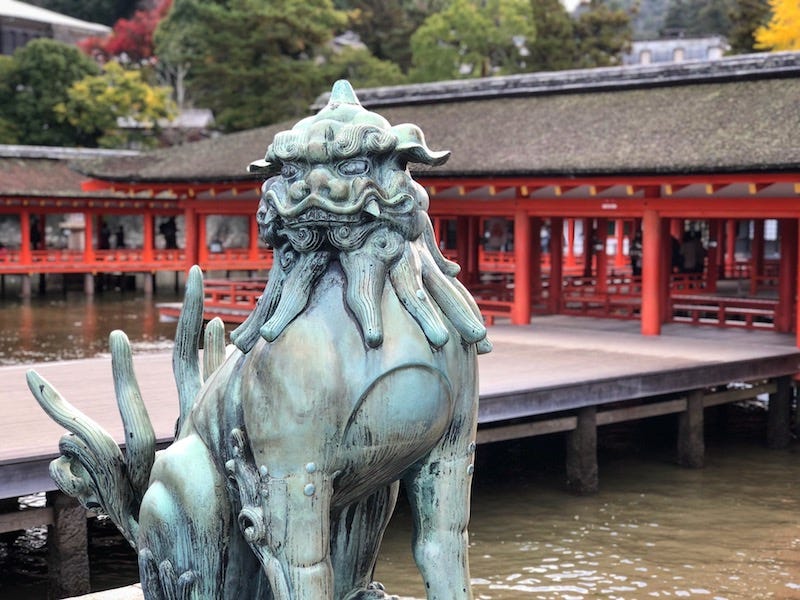 A koma-inu in front of Itsukushima Shrine on Hiroshima Prefecture’s island of Miyajima