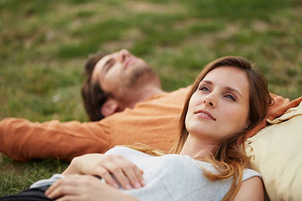 A couple sharing a peaceful, quiet moment in the park.