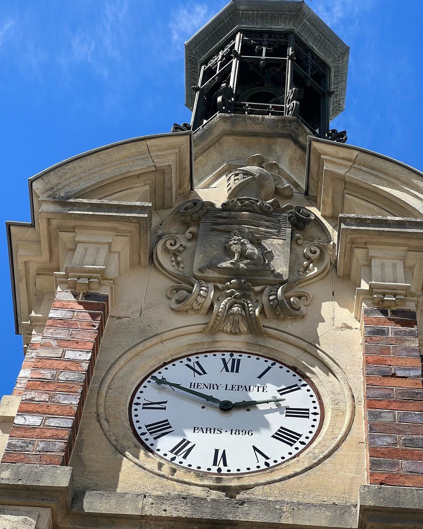 Photo of a clock tower at the horse stables at Chateau Orquevaux, France.