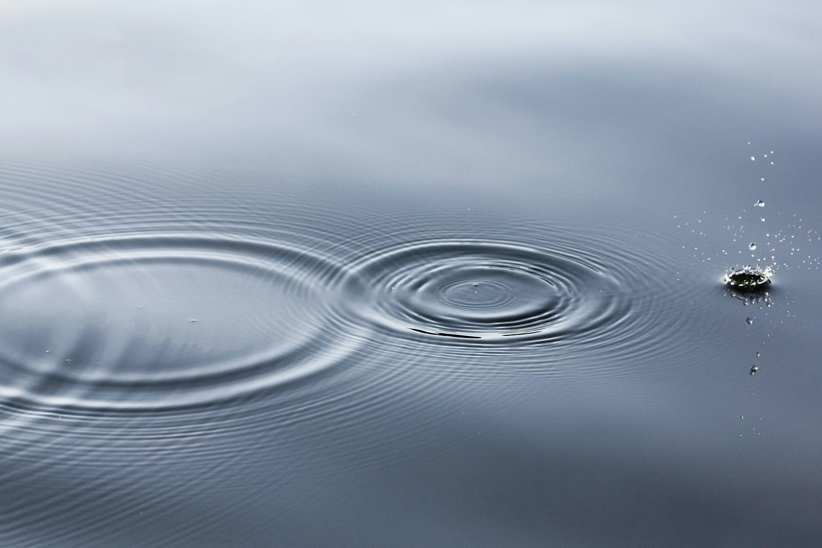 A hope skip and a jump. A stone makes ripples on a pond.