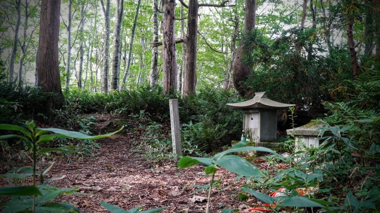 A small clearing with shrine to Yakushi Nyorai at the top of Mt. Fujikura