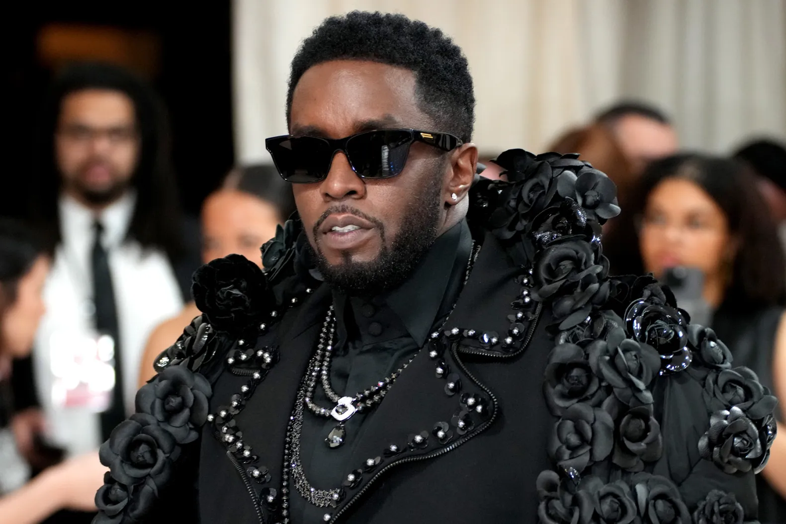 Sean Diddy Combs in a black coat.