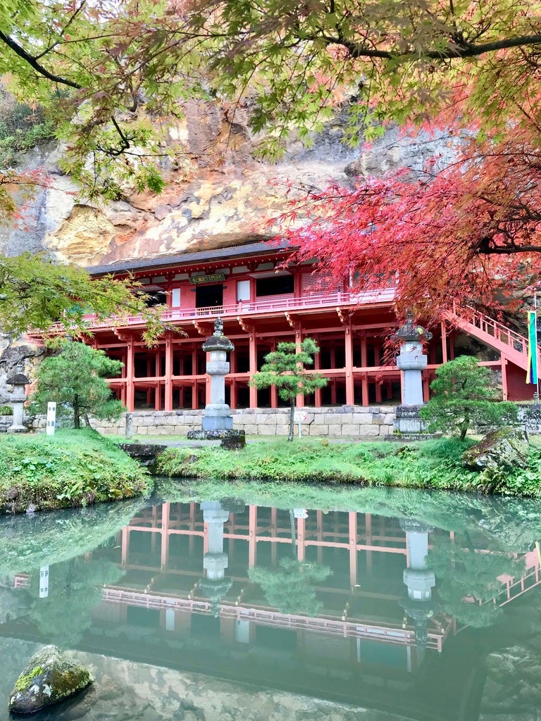 Takkoku Seikōji Temple reflects in its pond.