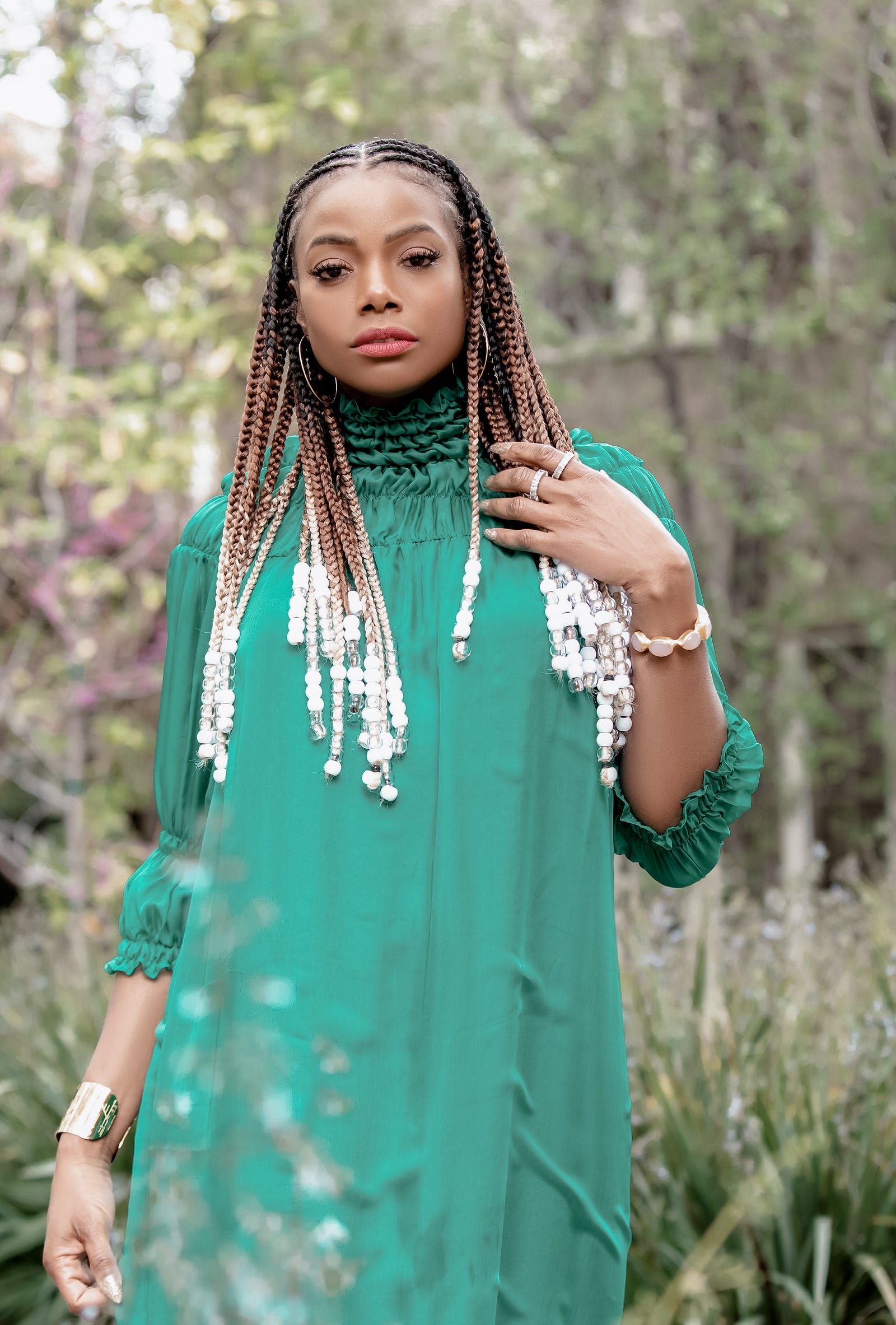 Tai Beauchamp wearing the emerald green maxi dress by Bastet Noir