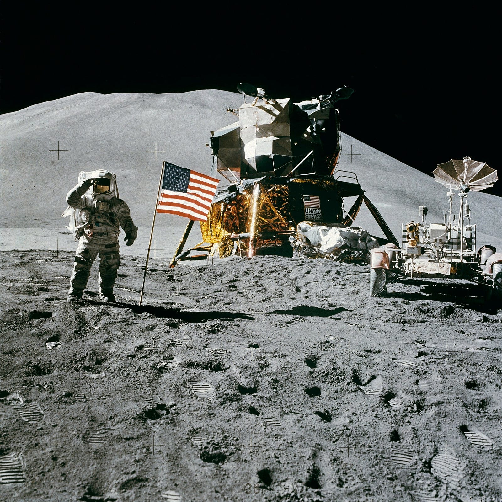 An American astronaut standing on the surface of moon.