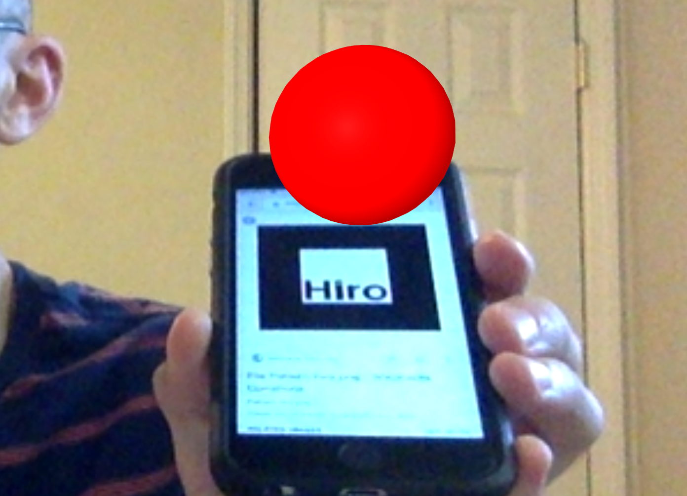 Demo of a red sphere hovering above the Hiro marker using AR.js