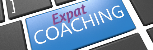 Words “Expat Coaching” on a blue computer keyboard
