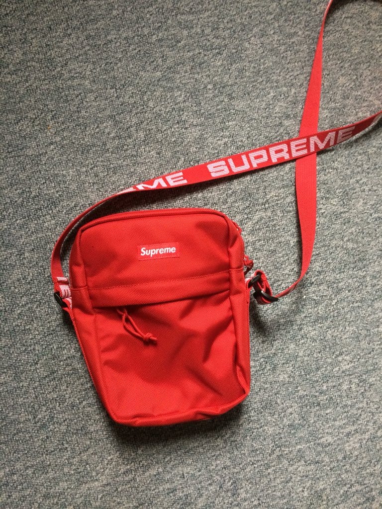 red supreme man bag