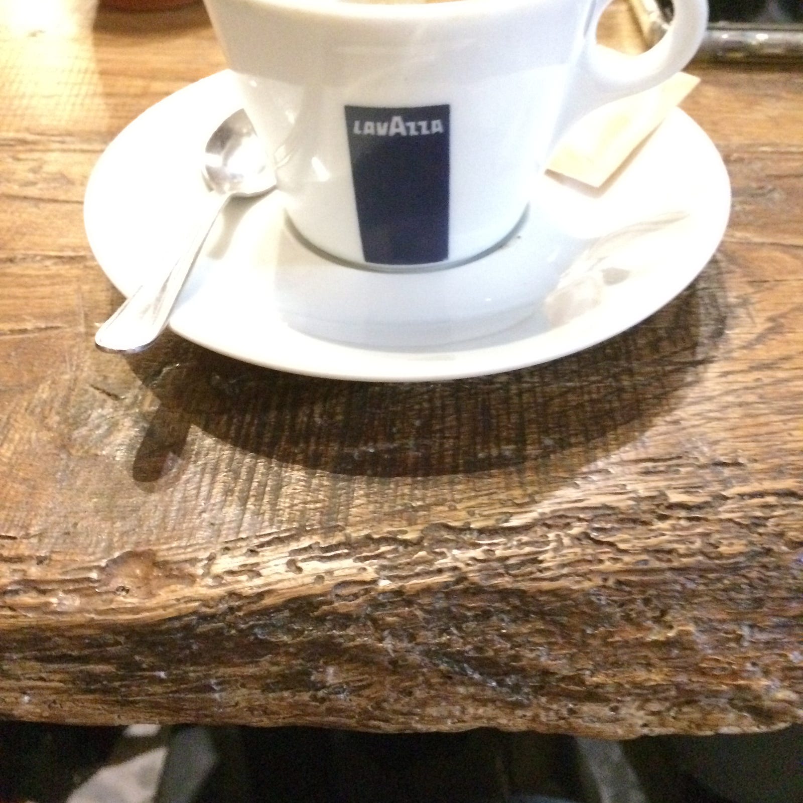 Photo of an old table with coffee in Tuscany