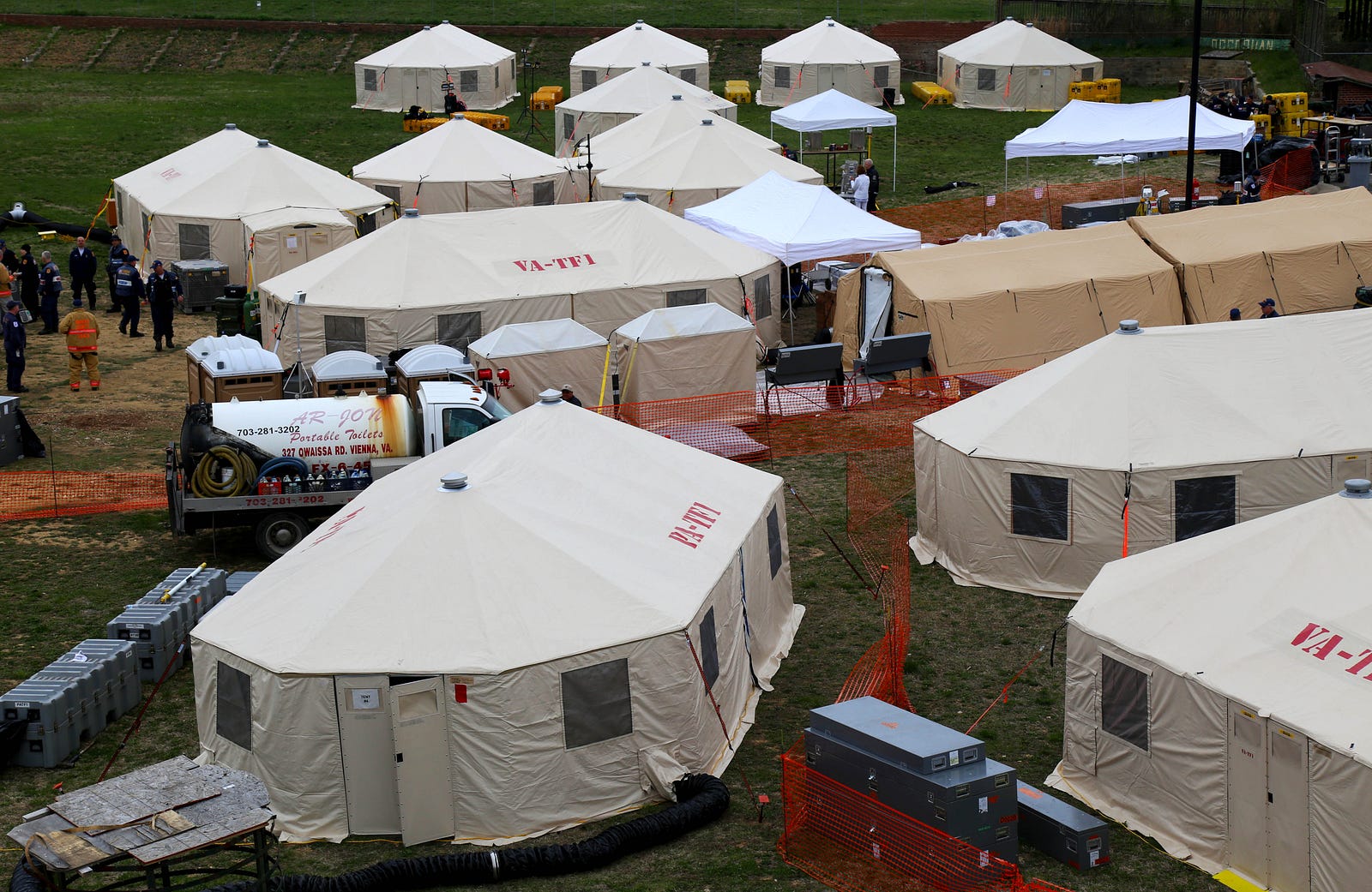 Aerial view of the base of operations. Bottom left: Keeping the operations center dry becomes a challenge after days of rain.