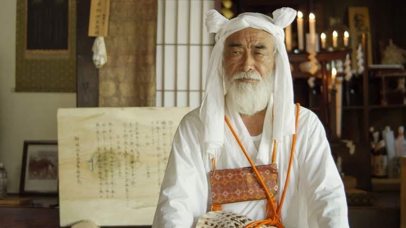 A master yamabushi mountain ascetic sits in a temple in Yamagata Prefecture