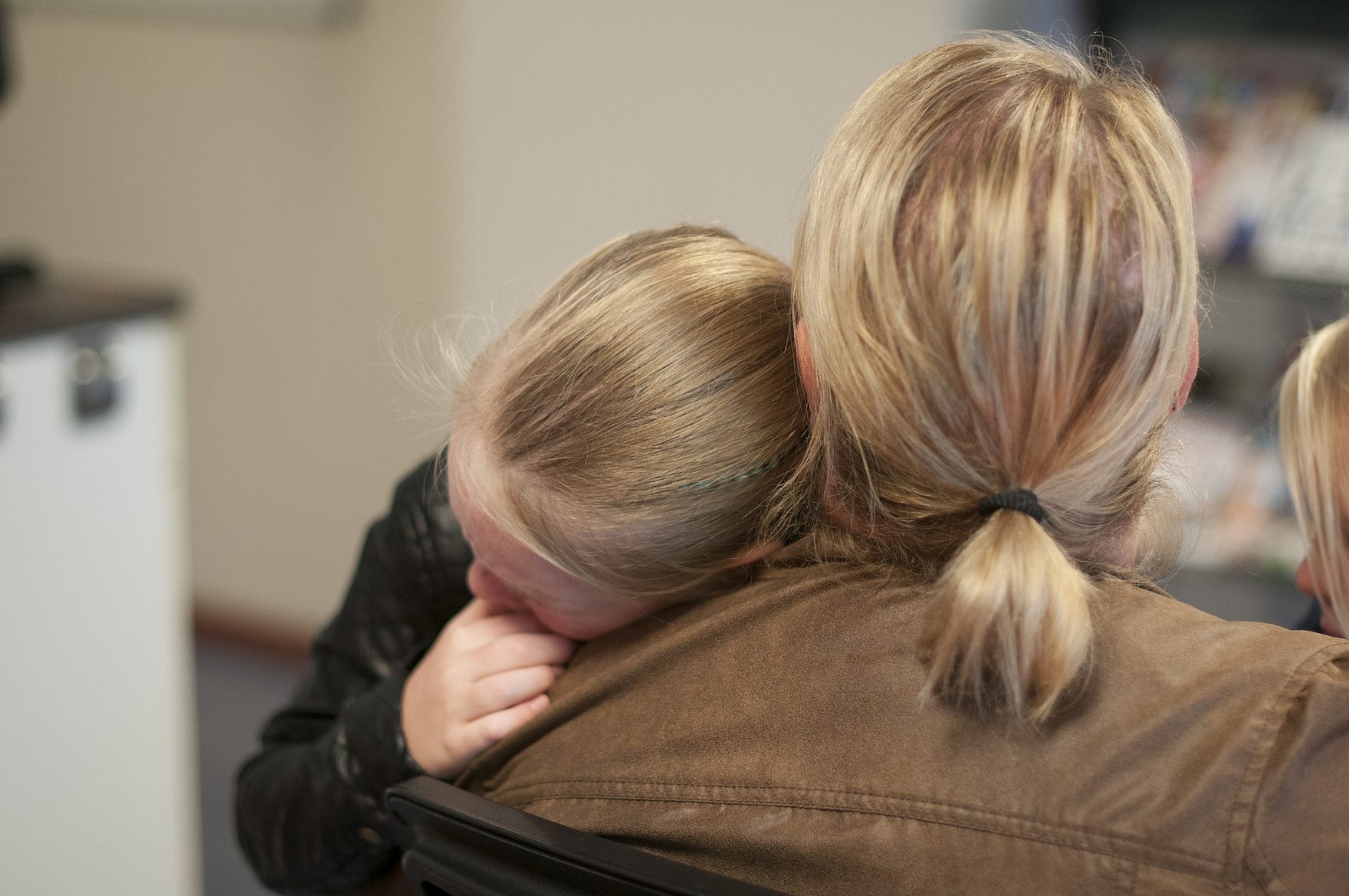 Mother hugging child. Reparenting your inner child. Barbara Cook blog