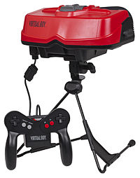 A red headset with a stand to place on a table, and an attached game controller.