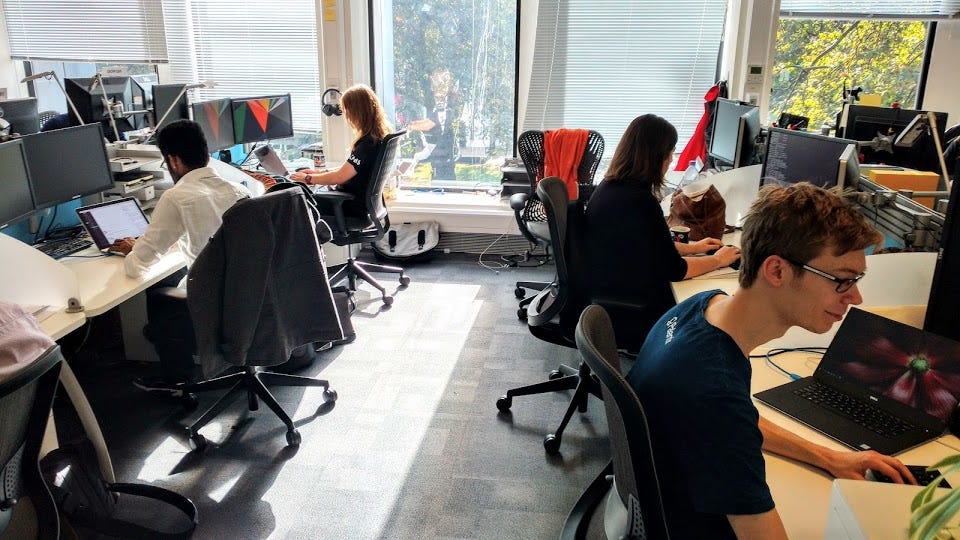 The team working at desks in the ISD office