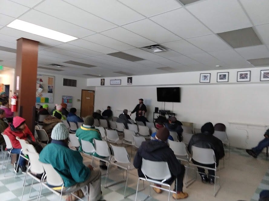 Clients gather for the town hall meeting at CCS to discuss their recent feedback through the Pulse For Good system.