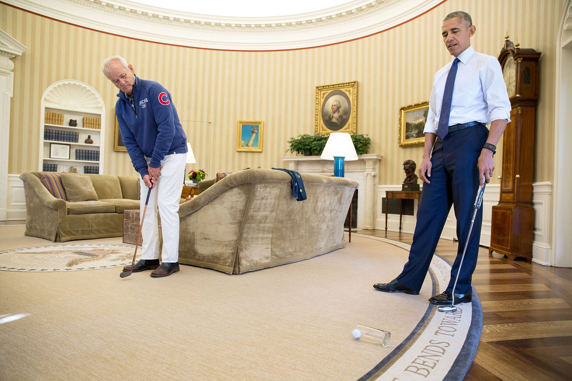 Oct. 21, 2016 “Bill Murray stopped by the White House to be honored as the recipient of the Mark Twain Prize for American Humor. When the President opened the door to the Oval Office, he laughed that Bill was in full Chicago Cubs regalia just before the Cubs were to begin the World Series. After the presentation, Murray demonstrated his prowess in putting, ‘sinking’ several putts into a White House drinking glass, all while doing a public service announcement to sign up for the Affordable Care Act.” (Official White House Photo by Pete Souza)