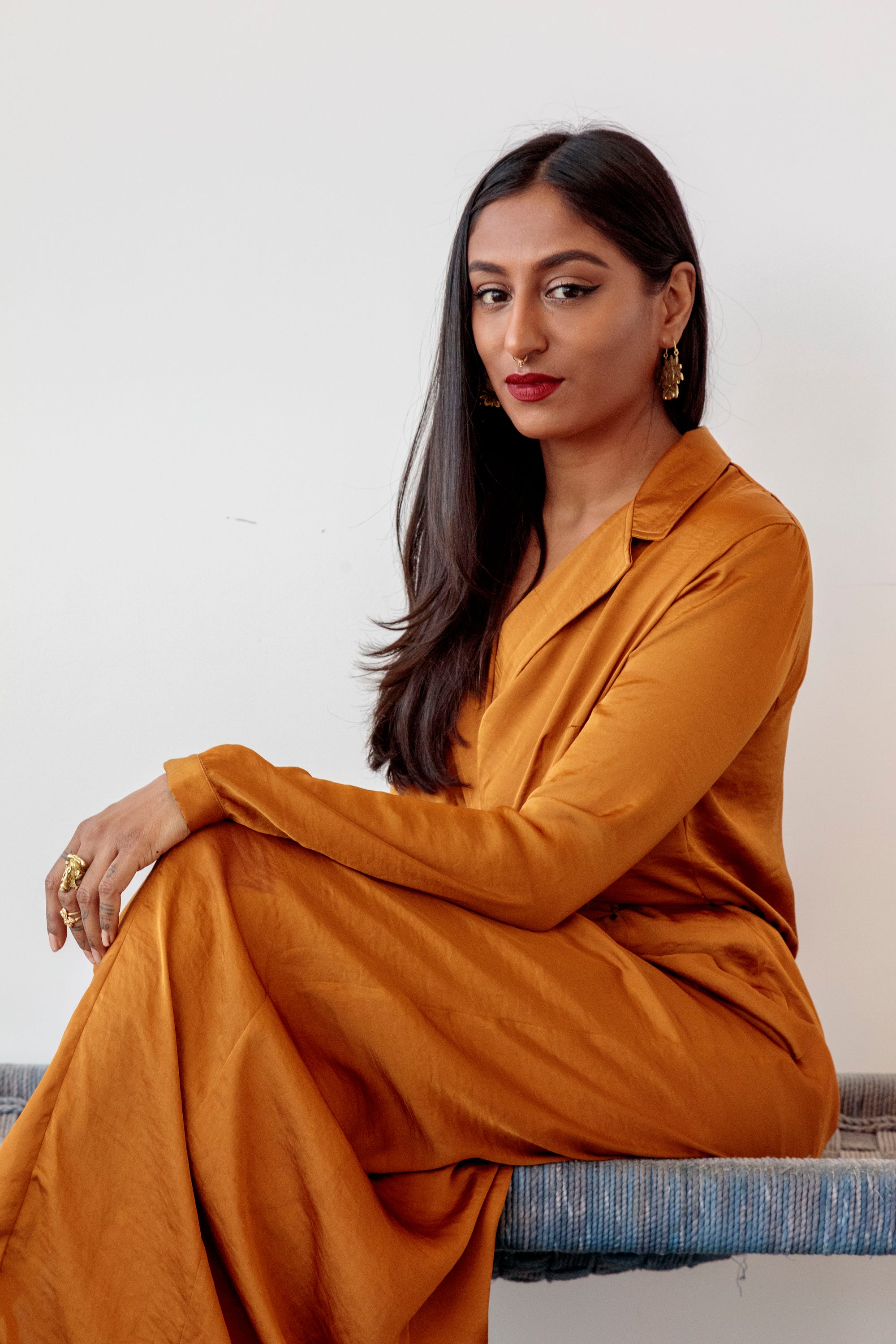 Pavana Reddy, the fierce poet who won our hearts over is wearing the marigold shirt dress by Bastet Noir, photo by: Joshua White