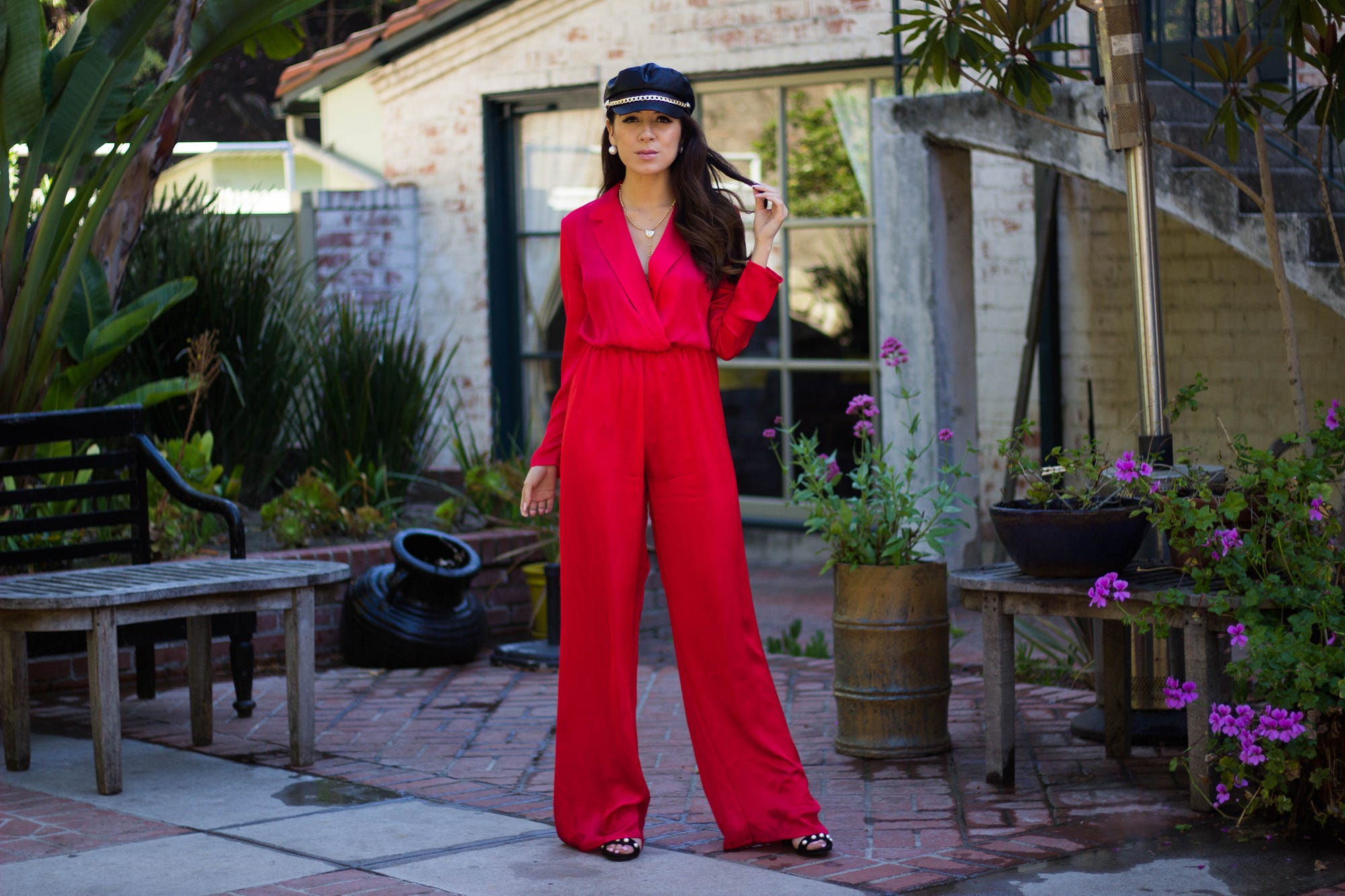 Jeniffer Avina wearing red silk jumpsuit