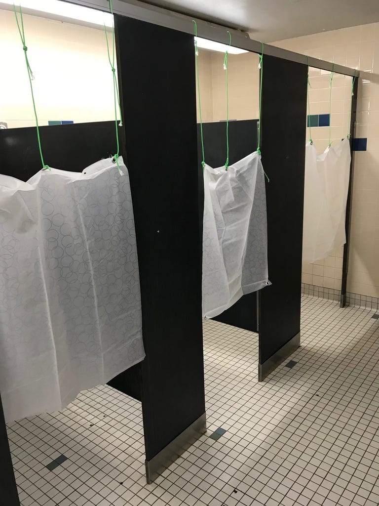 The new shower curtains that were installed at CCS in response to customer feedback.