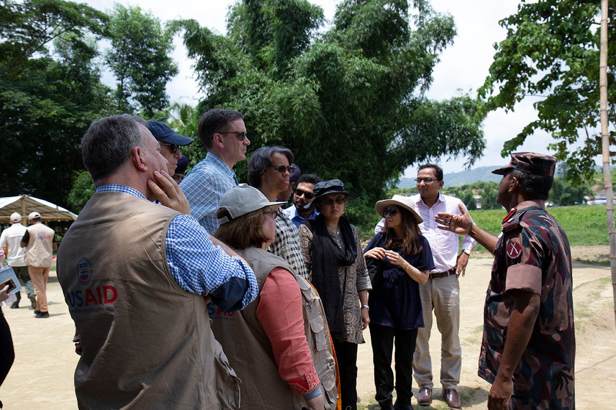 At the border, USAID Administrator Mark Green, third from left, heard from Border Guards Bangladesh about the waves of people fleeing violence in Rakhine for the safety of Bangladesh. Thankfully, they opened the border and allowed people to seek safety. (Anna Slattery, USAID)