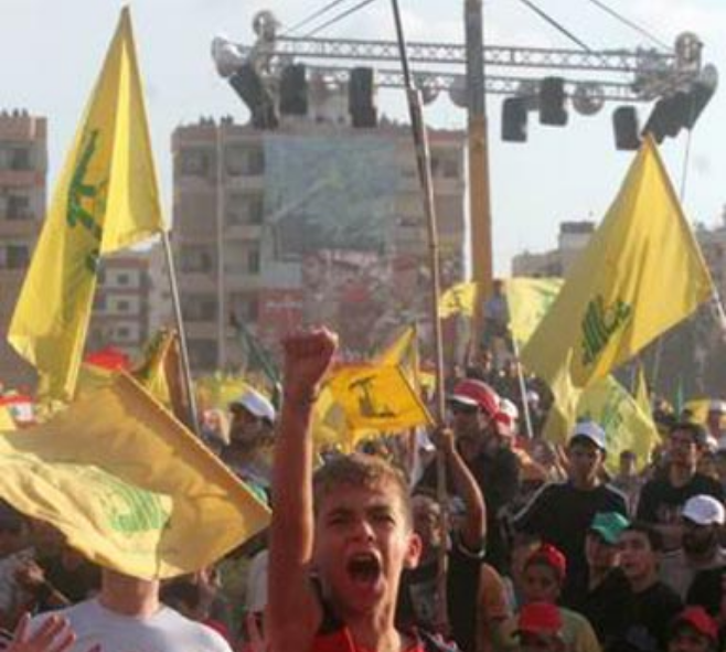 fragment of a picture credited to Yalda Moayeri (یلدا معیری) depicting a child at a Lebanon Hezbollah rally